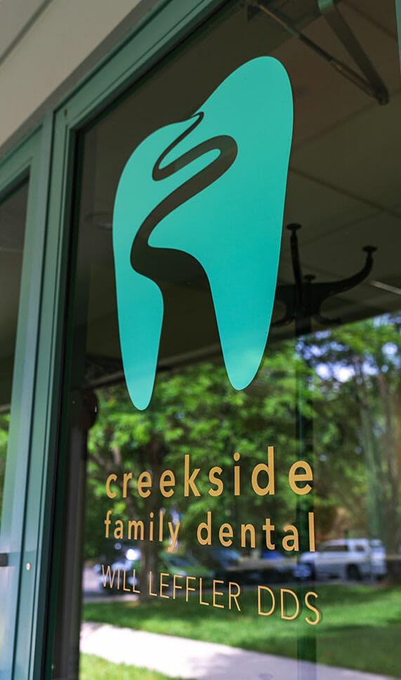 door logo at creekside dental office